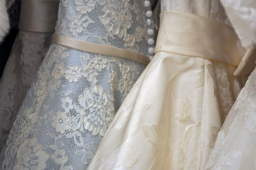 Lace wedding dresses on a rail