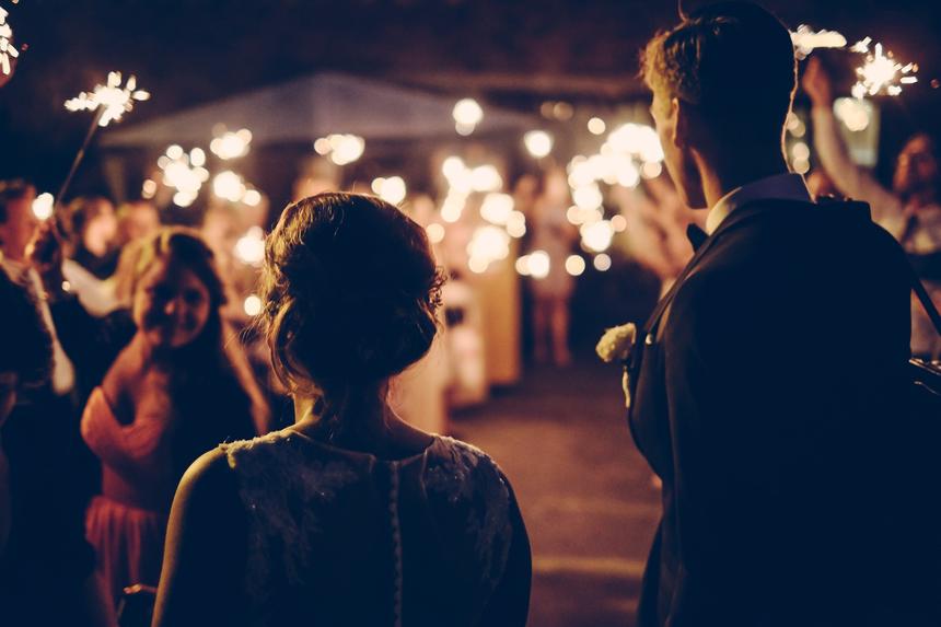 Guests with sparklers at a wedding party