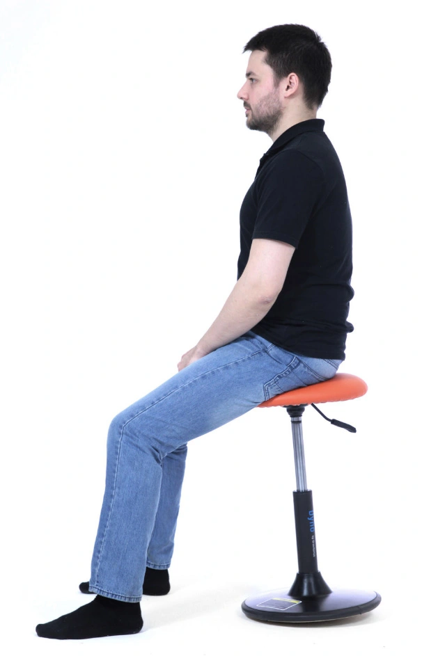 a man on a dynamic saddle chair