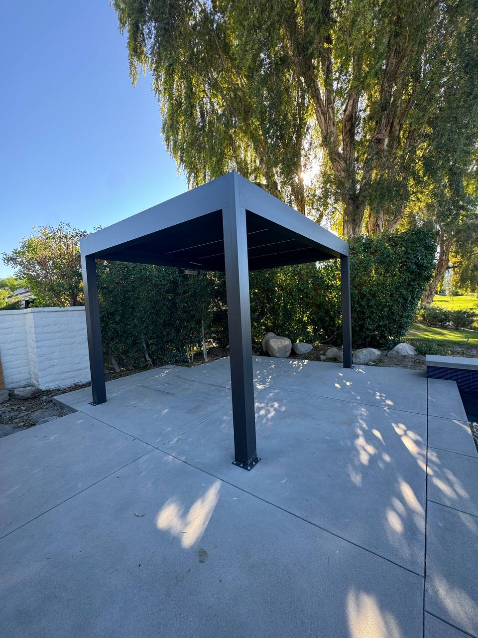 Poolside motorized louvered pergola installation detail
