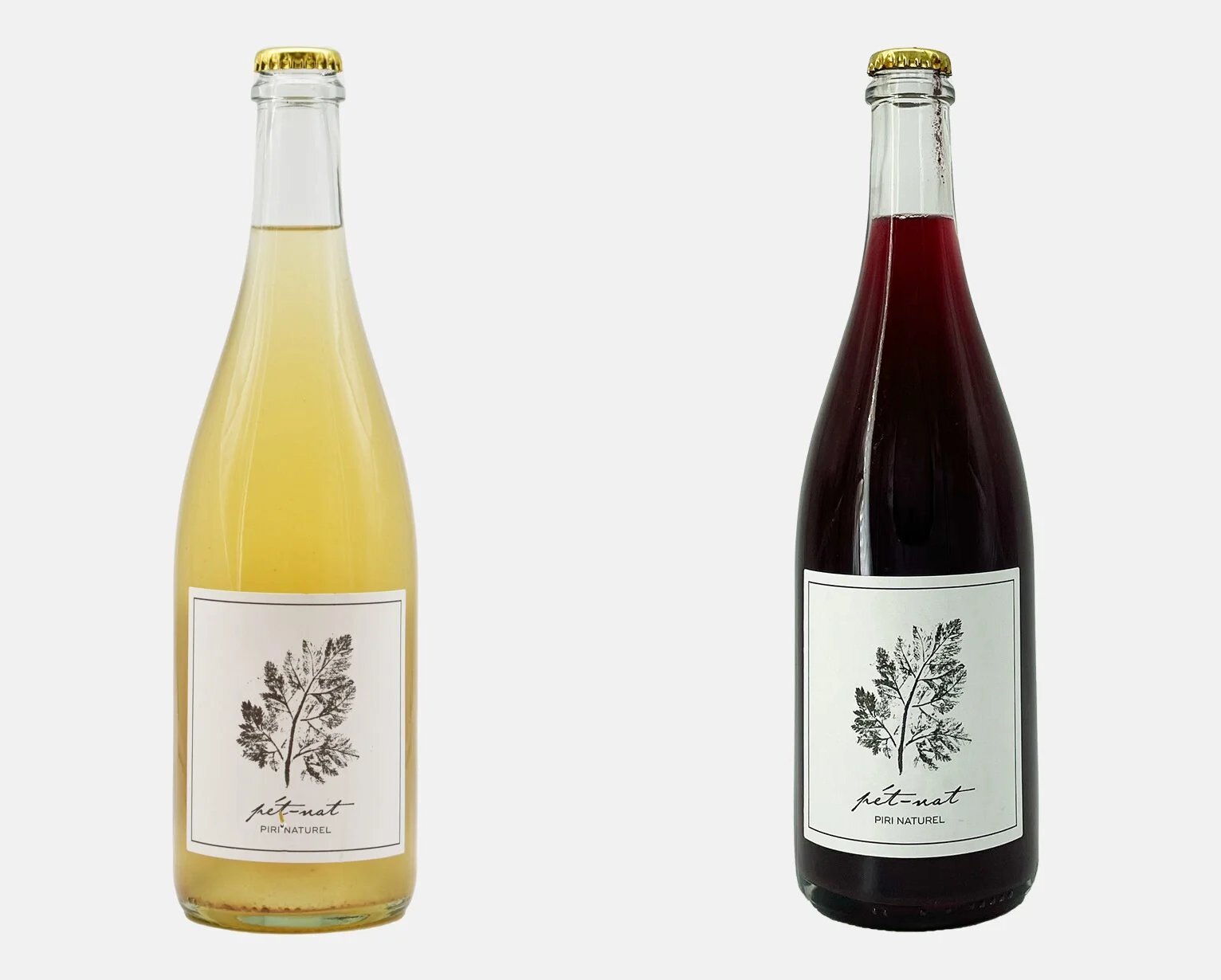 Two pét-nat bottles from Piri Naturel, white and rosé, with crown caps