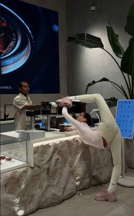 A gymnast stretching on the MR JADE counter