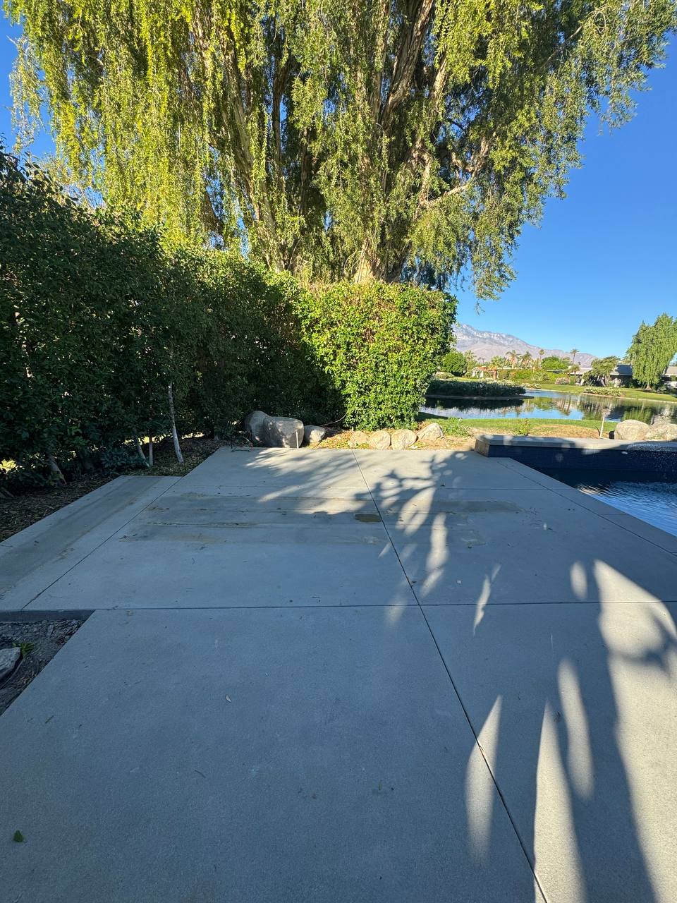 Existing concrete slab before the Lake Forest pergola was installed