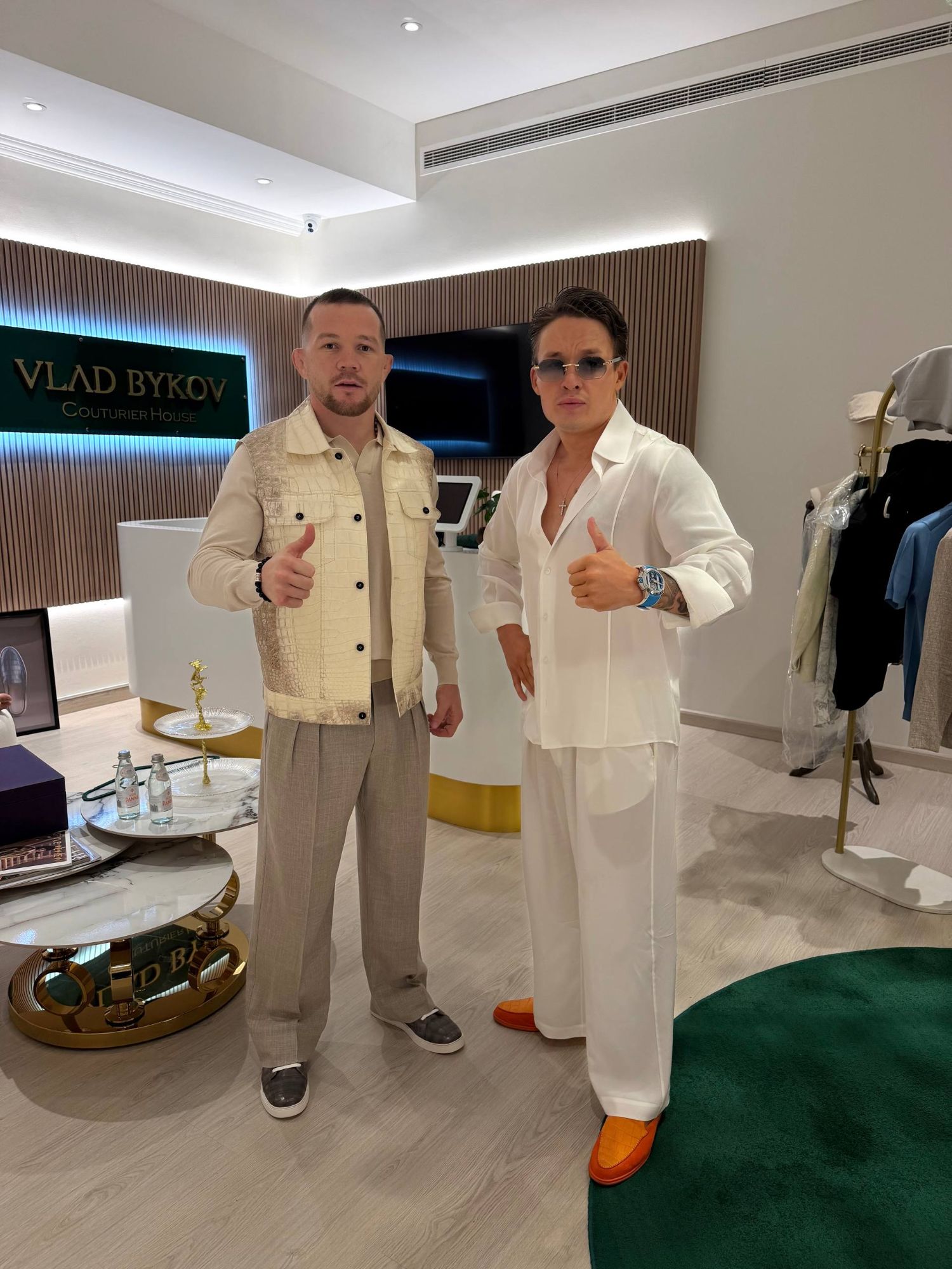Petr Yan in a Himalaya crocodile vest, light beige long-sleeve top, wide-leg trousers and grey crocodile sneakers at VLAD BYKOV Couturier House