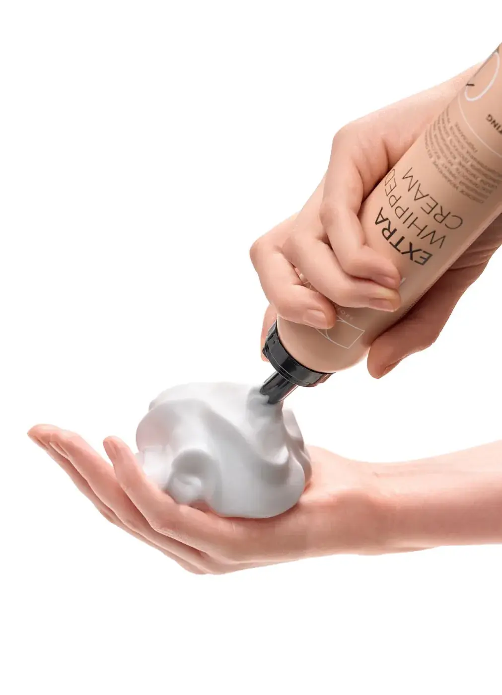 EXTRA WHIPPED CREAM foam in a hand