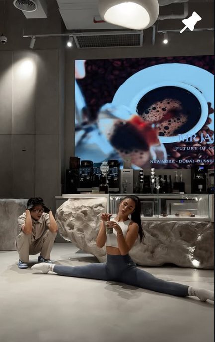 A guest doing the splits in front of the MR JADE bar