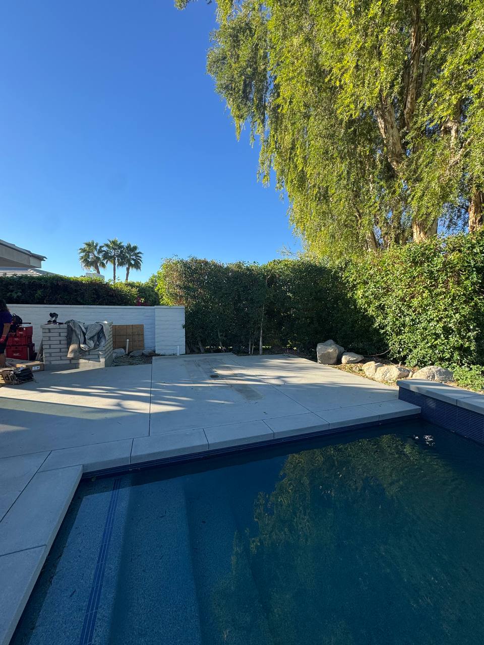 Poolside concrete patio before installation