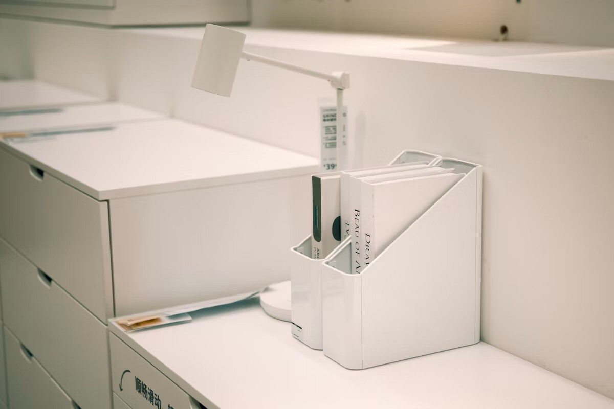 White desk organiser with files