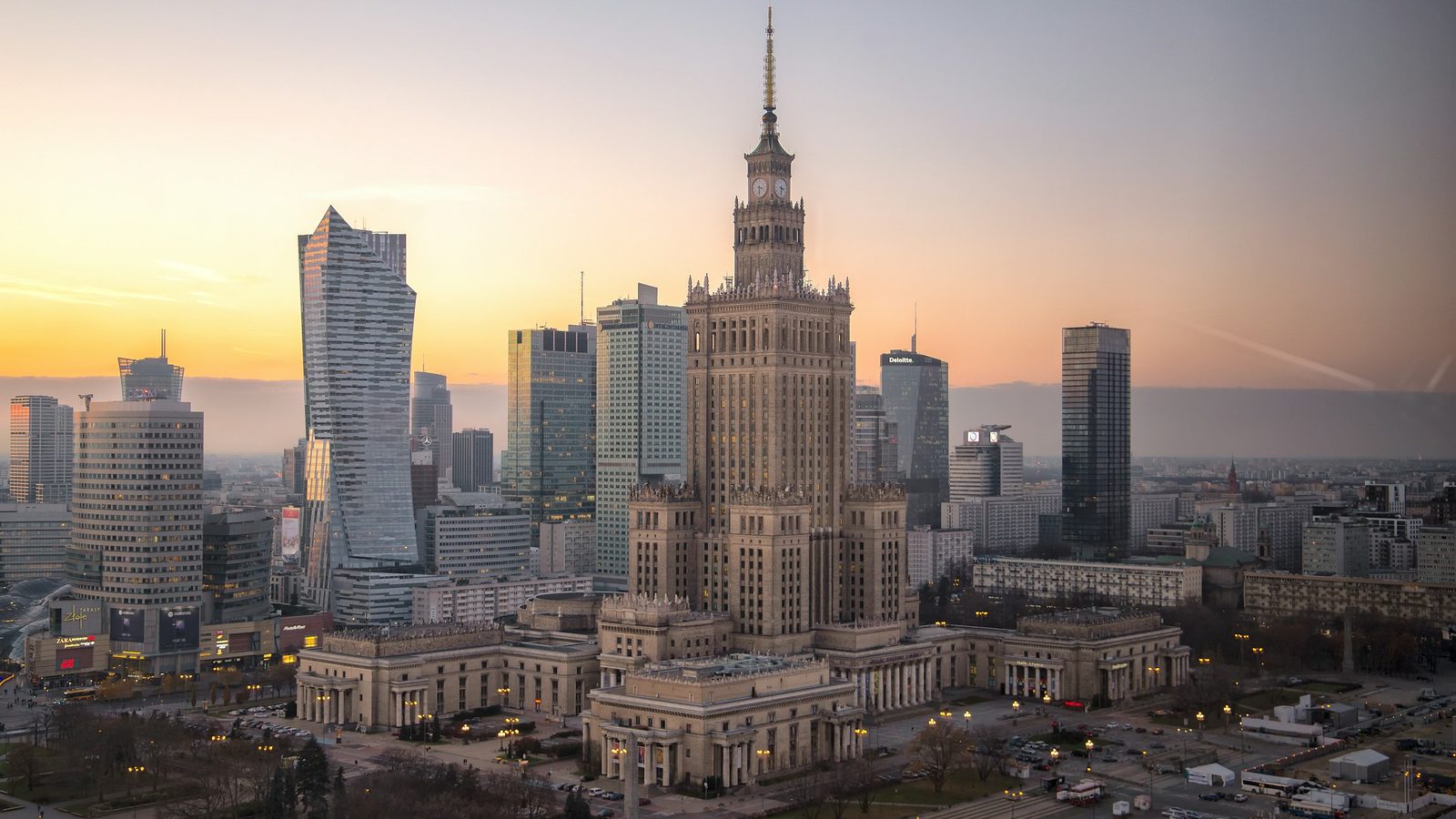 The Palace of Culture and Science and the glass towers of central Warsaw at sunset