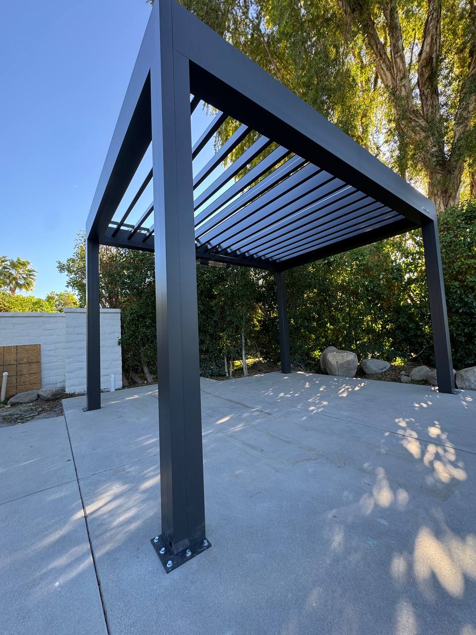 Open adjustable louvers on the completed freestanding pergola