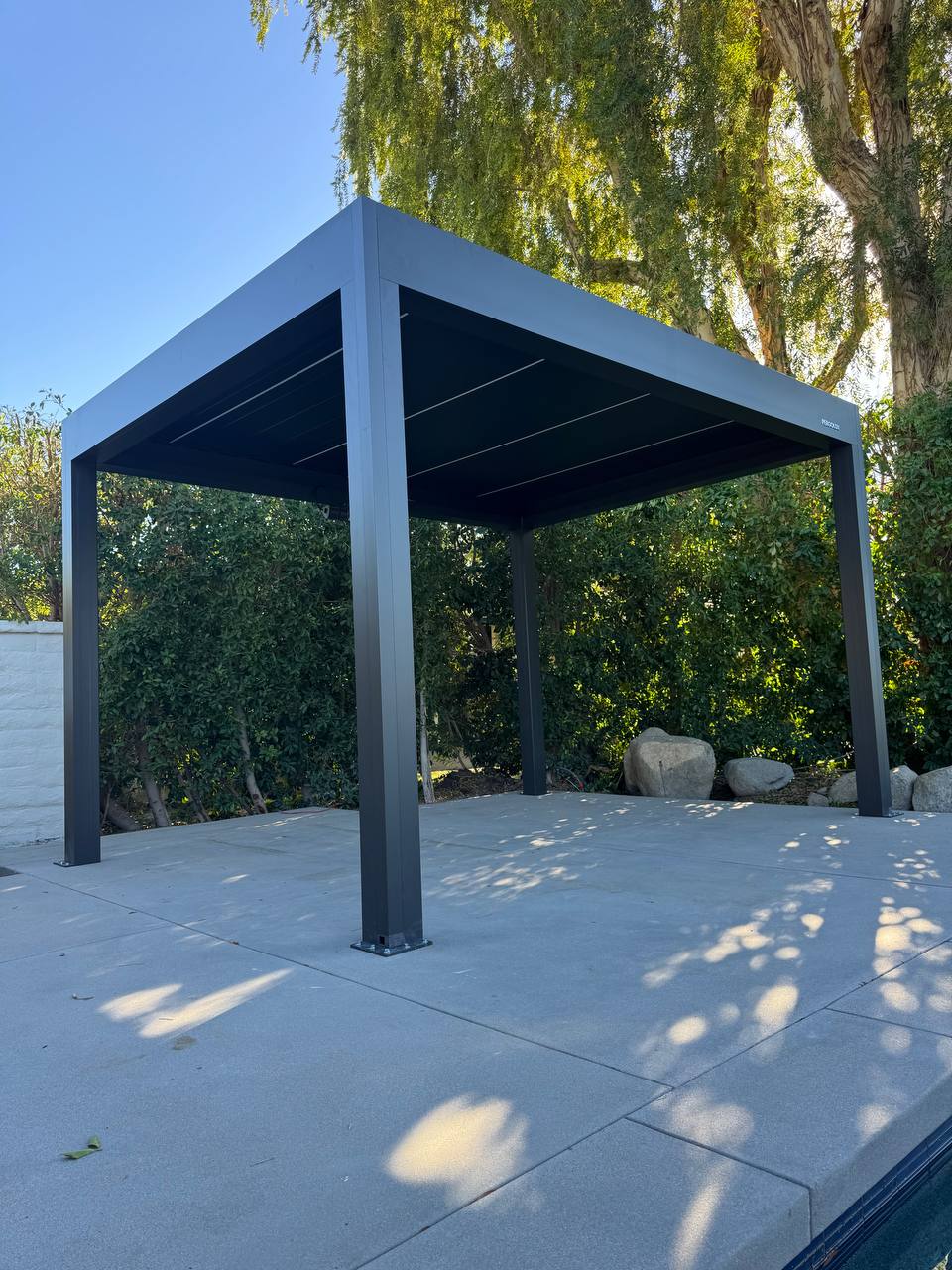 Completed 10 by 13 foot motorized pergola with louvers closed in Lake Forest