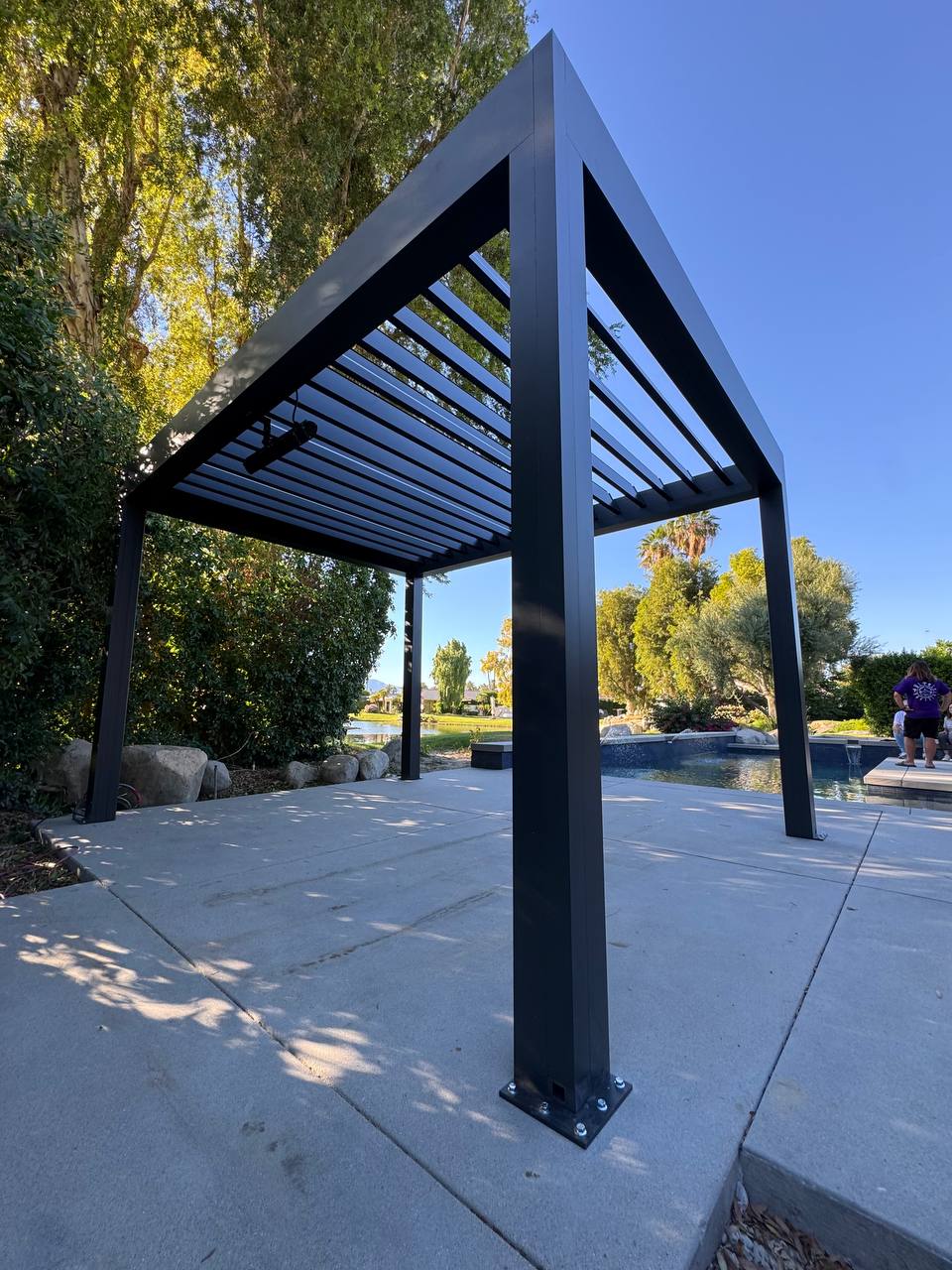 Adjustable louvers open on the completed Lake Forest pergola