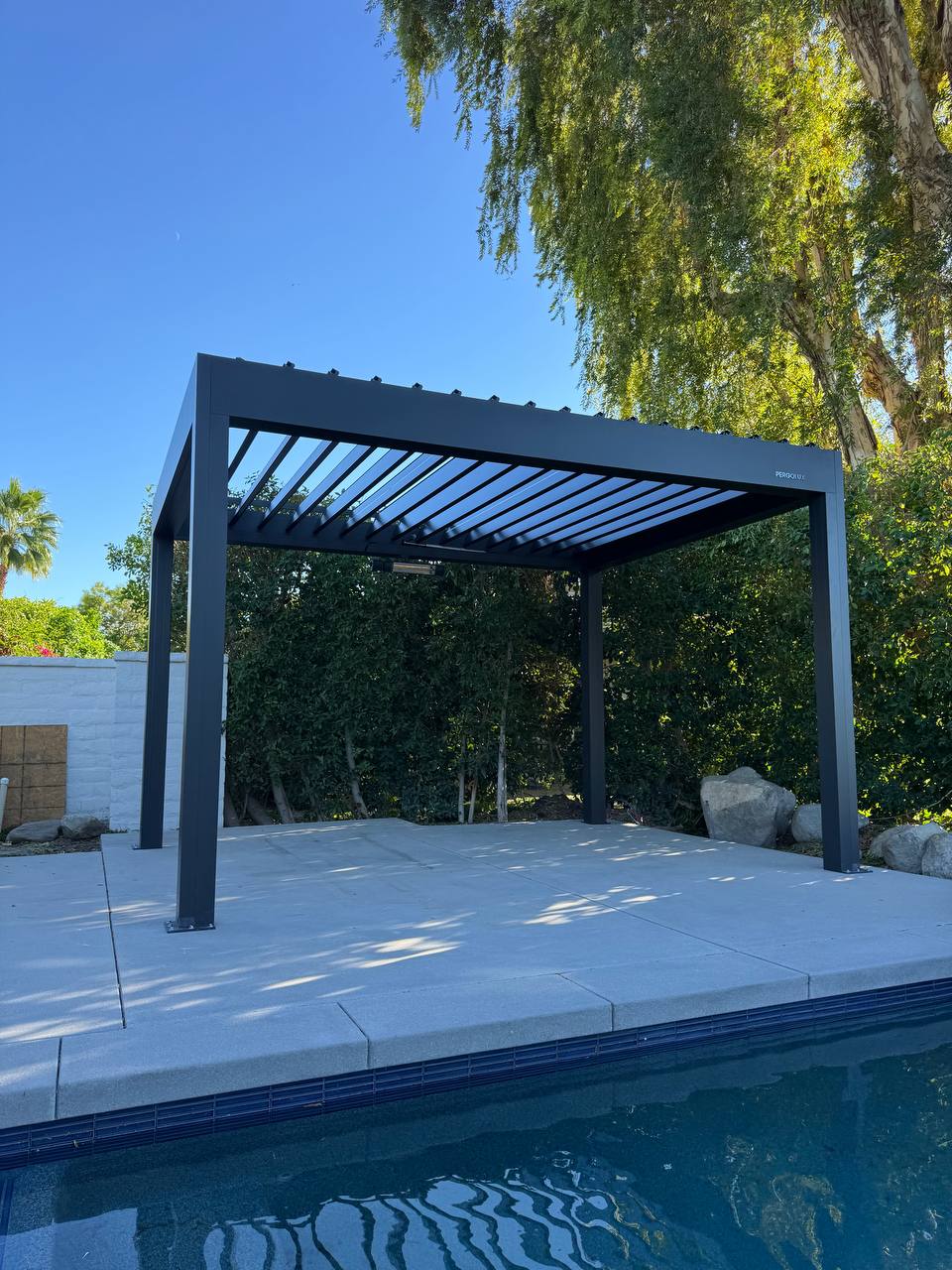 Completed Lake Forest poolside pergola with open louvers
