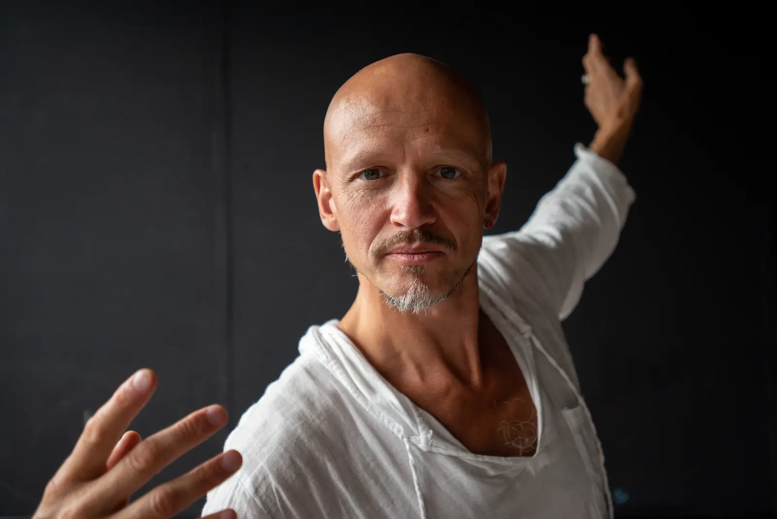 Konstantin Grouss in Intuition of Form, 2003 — a figure, image of a sculpture stepping out of its form. Performer: Tatyana Fateeva. Photo by Elena Potyeva