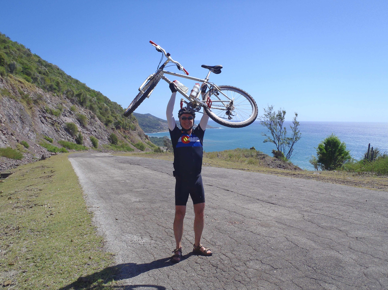 Lee riding in Southern Cuba along the scenic South Coast Road, one of the top cycling rides in the world.