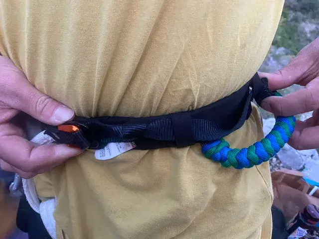 Stopper knot on the waistbelt of a highlining harness