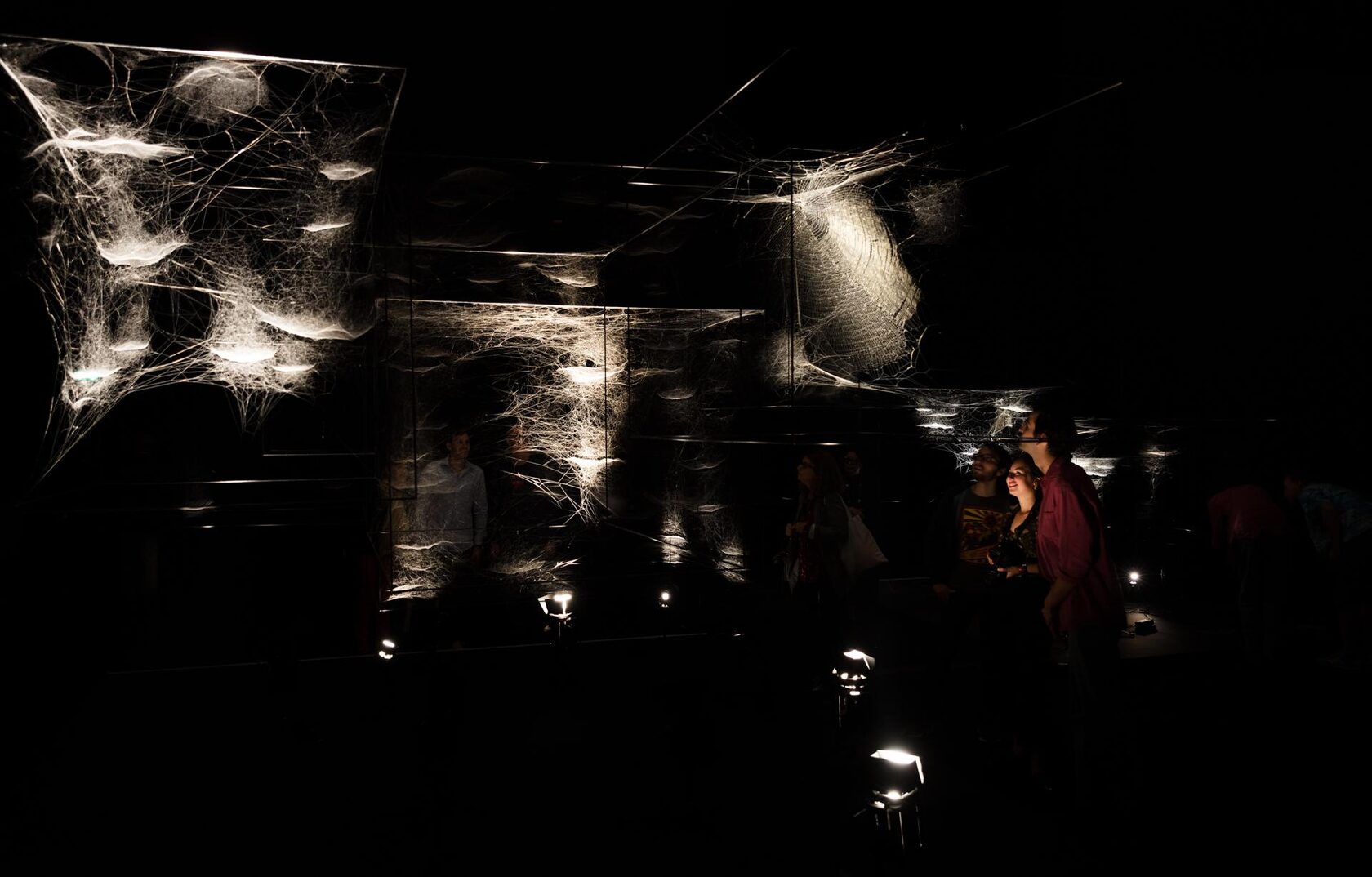 Webs of At-tent(s)ion, 2018. 76 spider frames, spider silk, carbon fiber, lights. Installation view at ON AIR, Carte Blanche to Tomás Saraceno, Palais de Tokyo, curated by Rebecca Lamarche-Vadel. © Photography by Andrea Rossetti, 2018