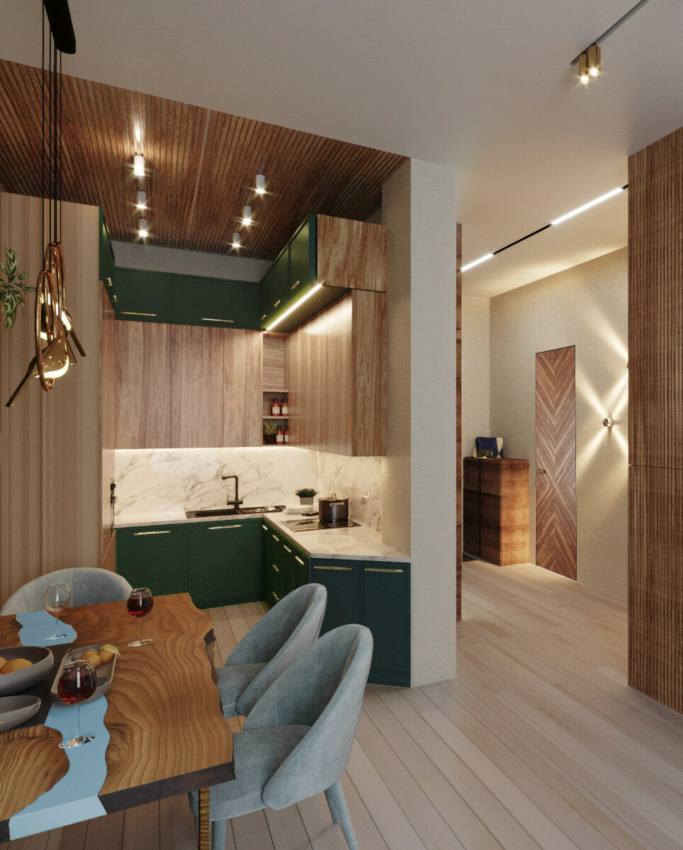 дизайн зелёной кухни с реечным шпонированным потолком, обеденным столом из слэба дерева, светильниками в виде птиц