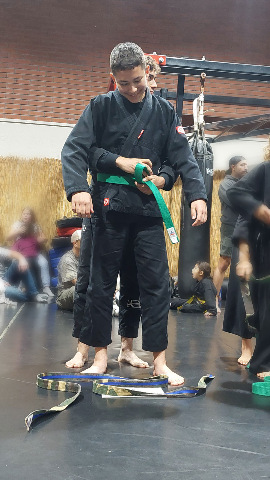 Eddie Fischer receiving a his adult green belt during a belt ceremony at The Pit Martial Arts in arroyo Grande ca.