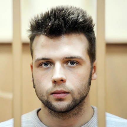 (12) Ilya Gushchin was arrested on February 6, 2013. He was charged under 2.212 (“mass riots”) and 1.318 (“the use of violence against a government representative”) of the Criminal Code. On August 18, 2014, he was sentenced to 2 years and 6 months in a penal colony. He was released on 5 August 2015. ~