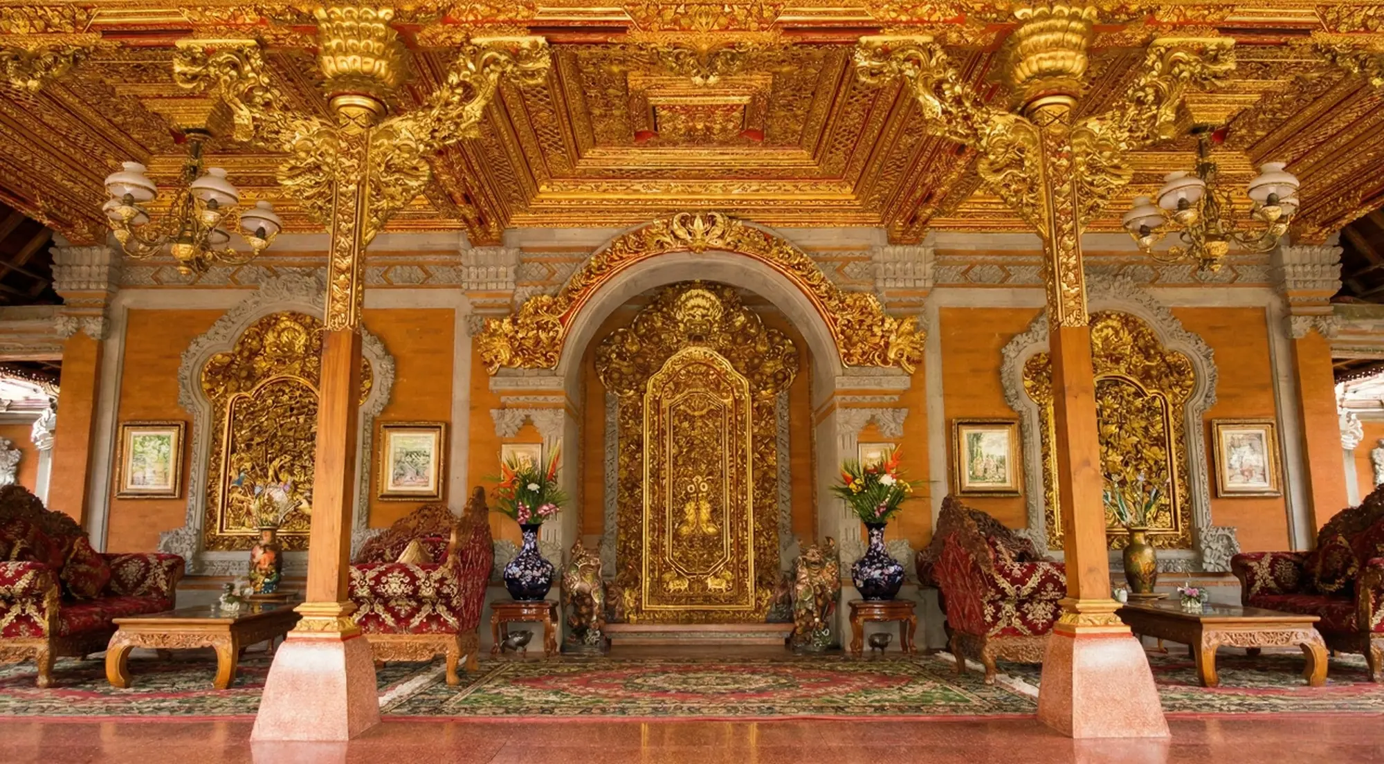Ornate interior of Ubud Palace showcasing golden Balinese carvings, traditional decor, and royal pavilion architecture in Ubud