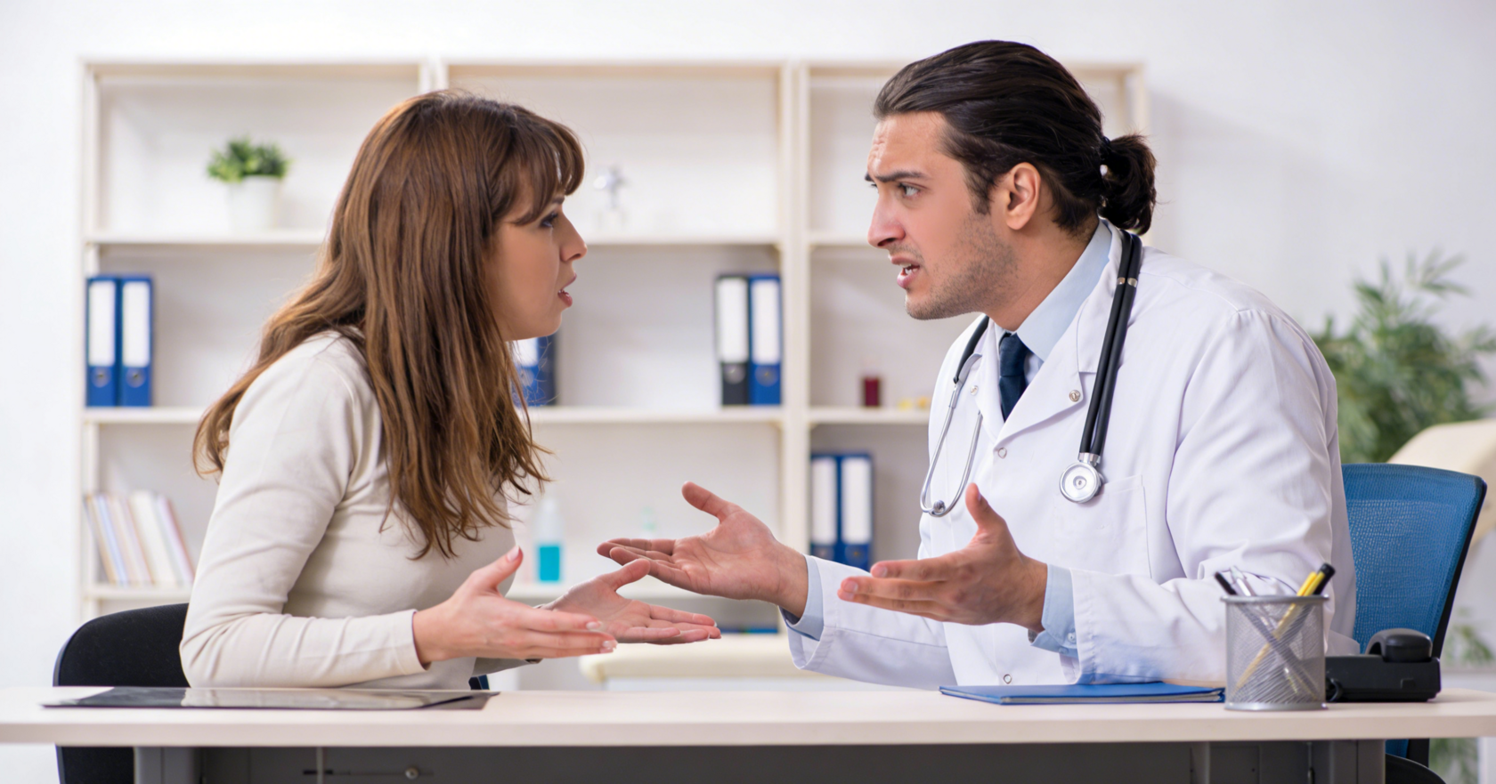 the doctor is arguing with the patient's family.