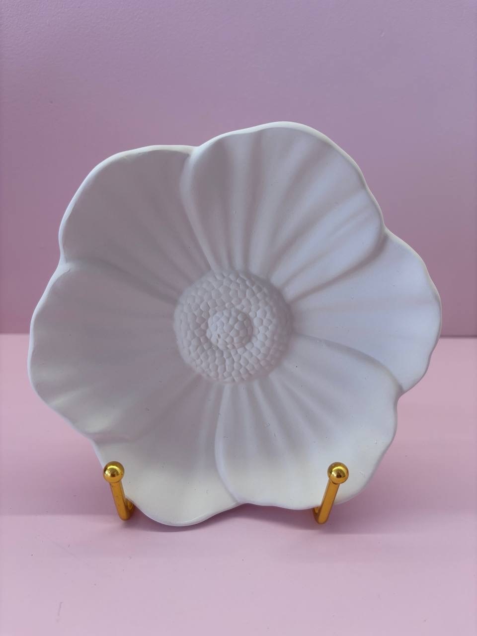 Friends painting pottery