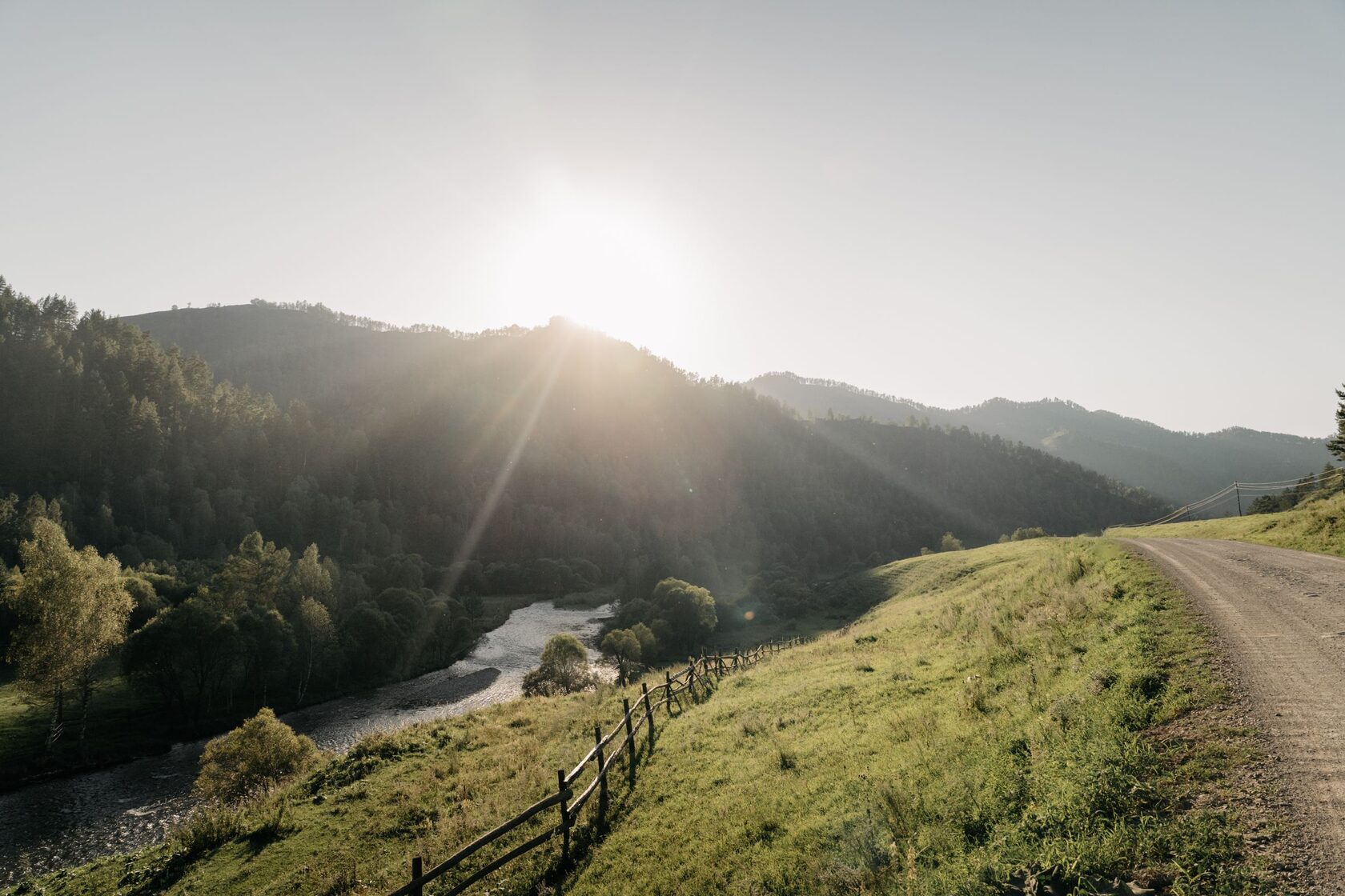 Sunlit mountain valley at sunrise