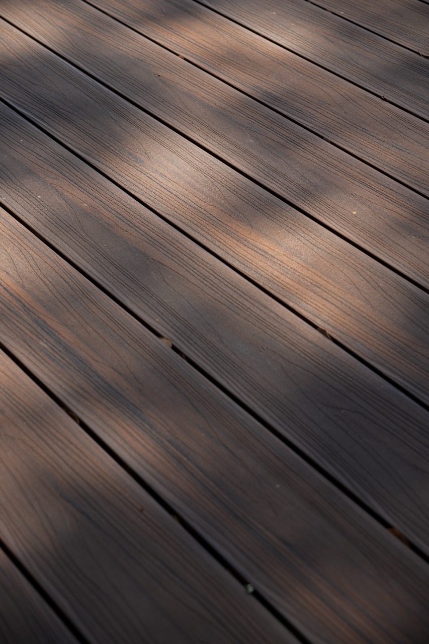 Close-up of dark wood-look composite decking boards