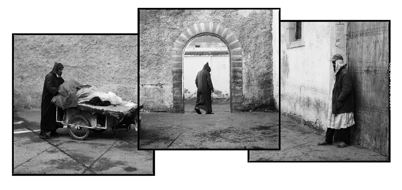 Three Moroccans and the small gate of the medina. Essaouira. Morocco. BW negative 6x6