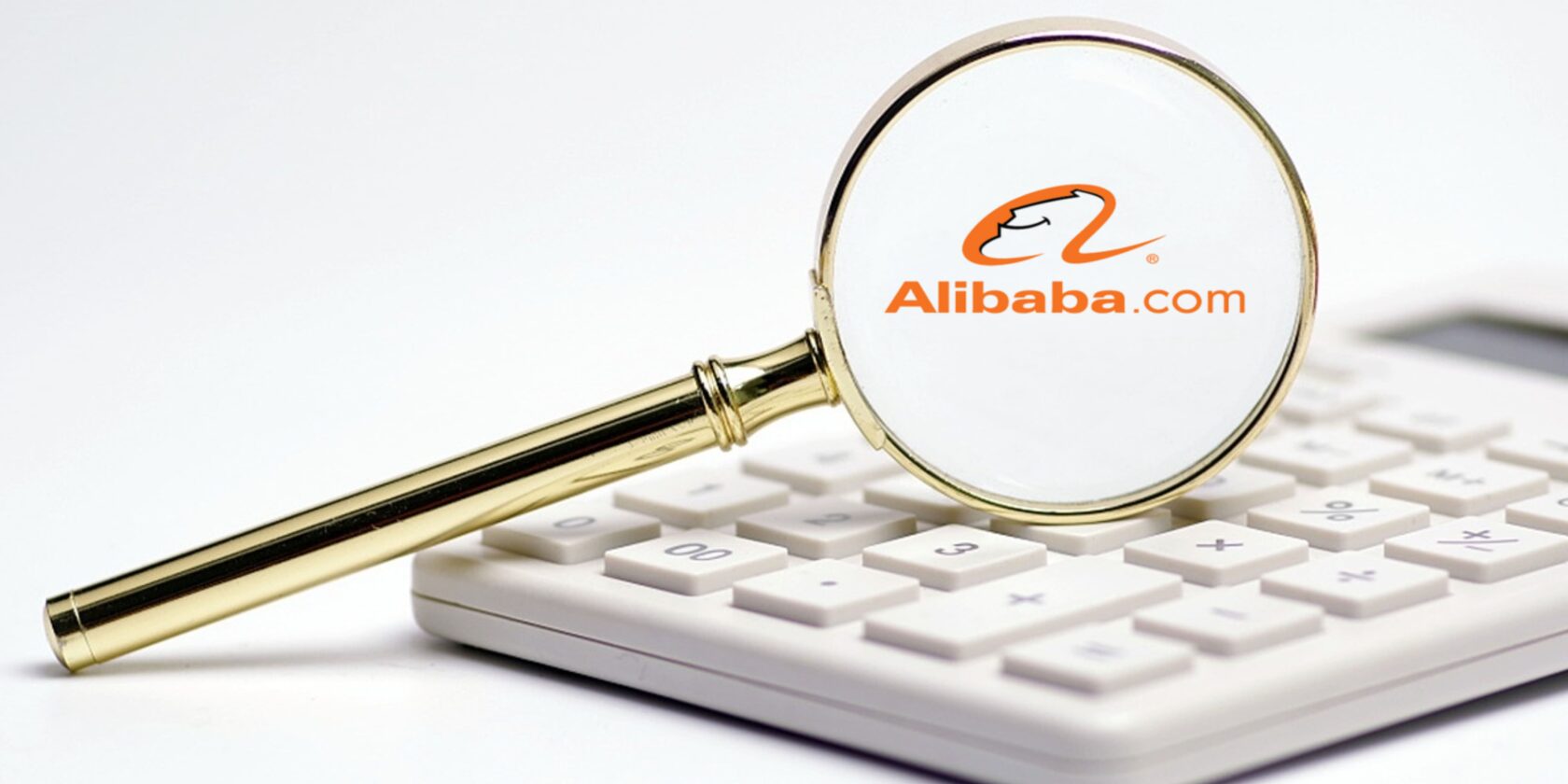 calculator and  magnifying glass with Alibaba logo on it