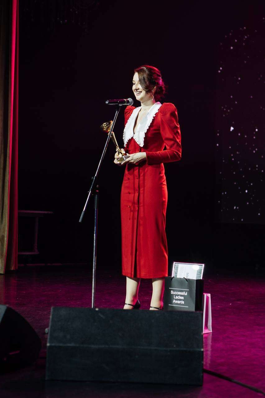 Maria Guryeva accepting an award on stage