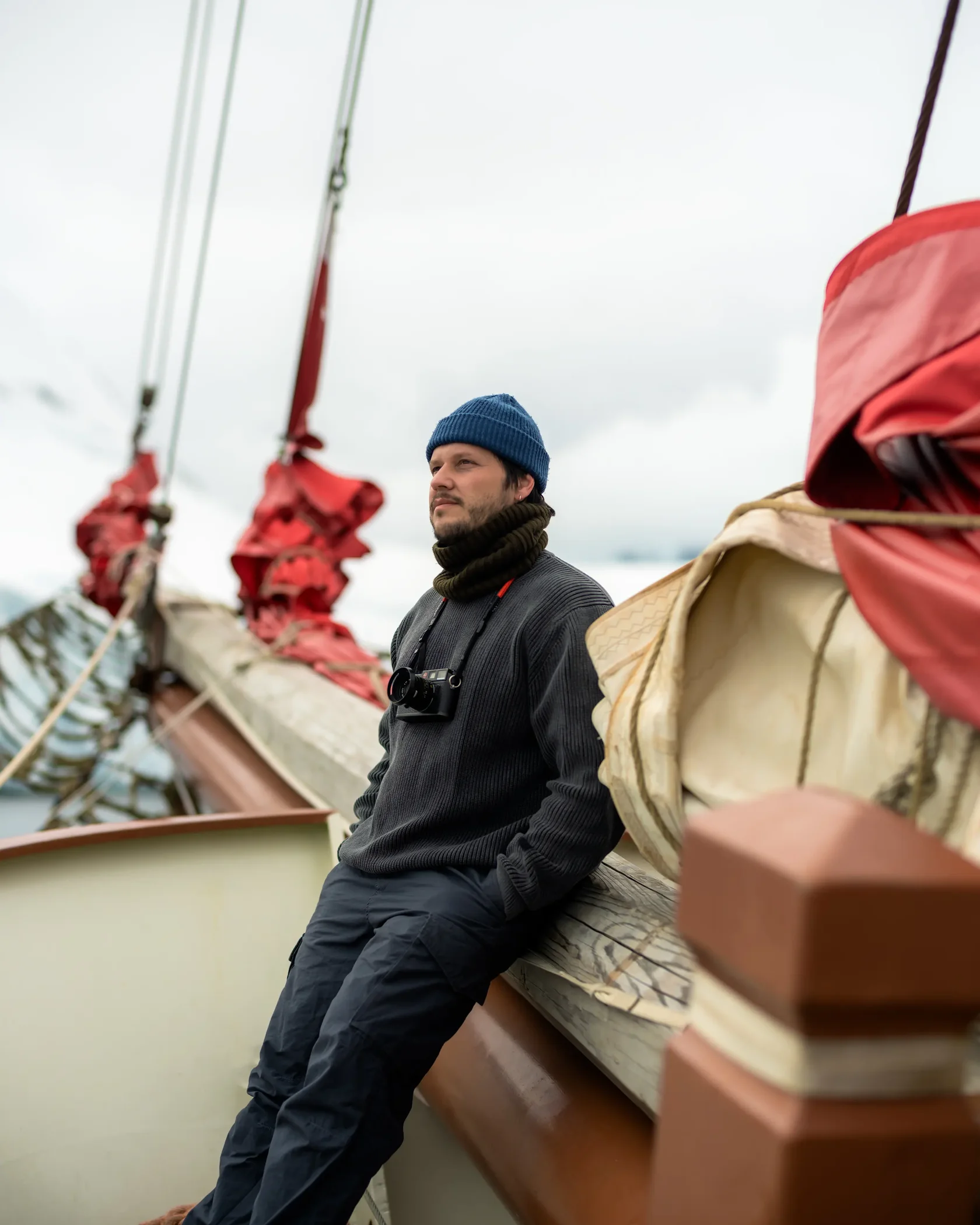Traveler aboard a sailing yacht during a small-group Antarctica expedition experiencing life at sea on an Antarctic adventure.