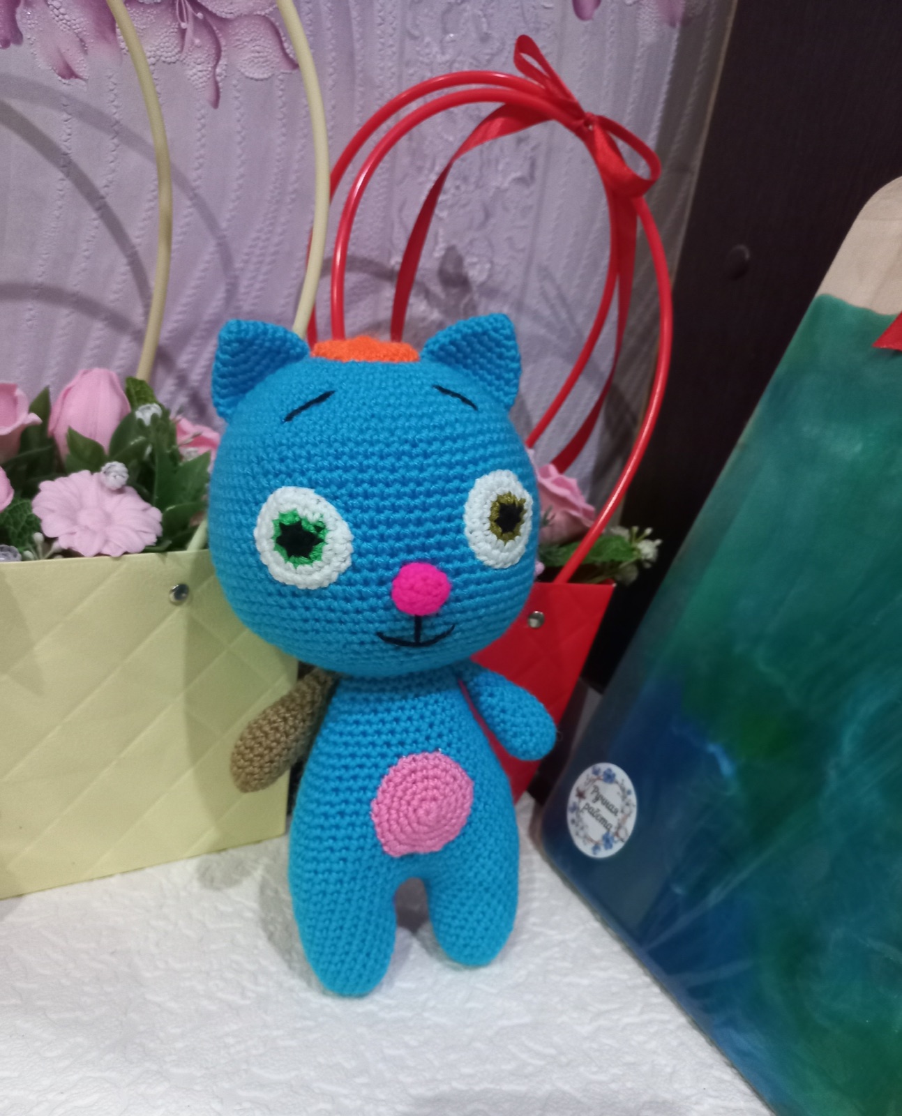 A handmade crocheted Mormitten