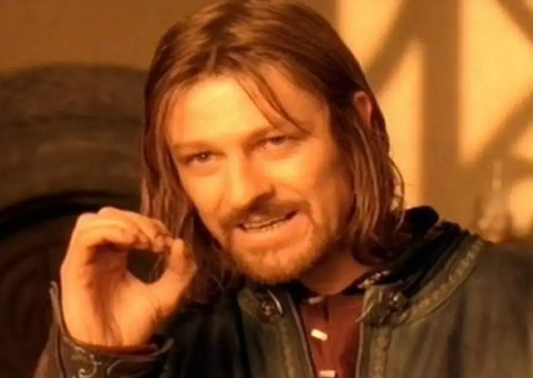 Кадр из фильма Властелин колец: Братство кольца — мужчина с длинными волосами делает жест рукой, произнося фразу «One does not simply»