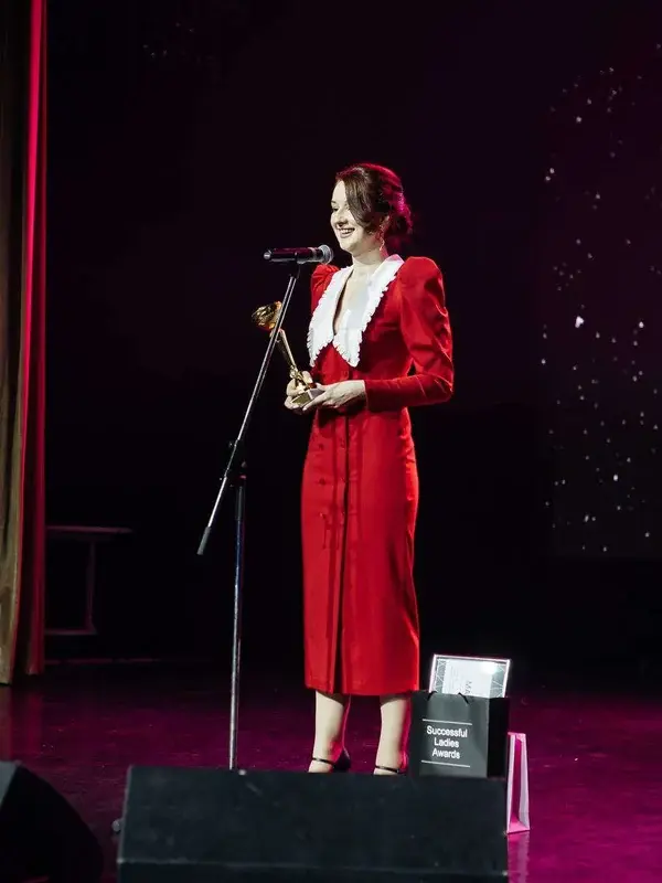 Maria speaking on stage