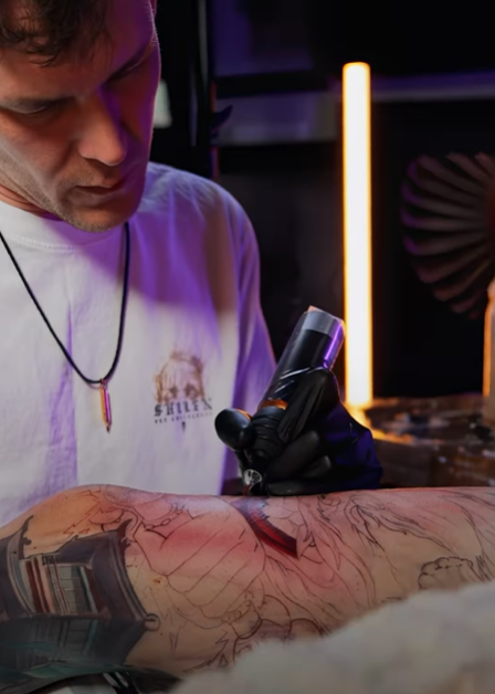 A tattoo artist in Los Angeles creates a Japanese-style tattoo.