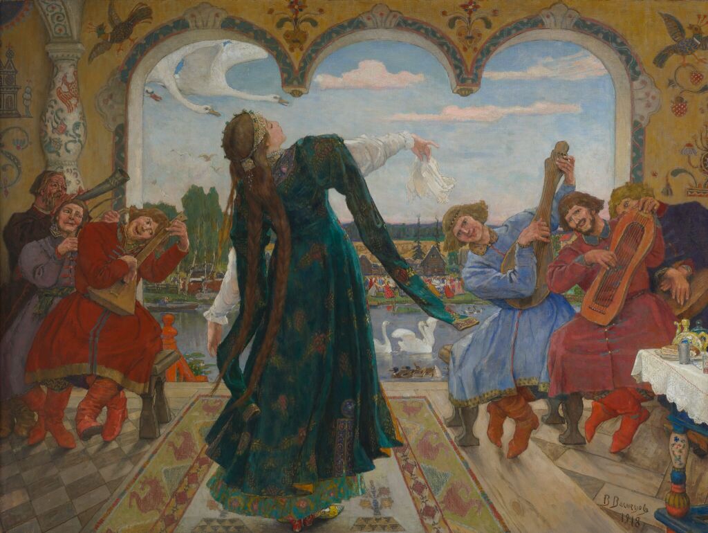alt="Картина Виктора Васнецова «Царевна-лягушка» (1918), Третьяковская галерея. Иллюстрация к русской народной сказке: царевна танцует в палате, музыканты играют на гуслях и балалайке, на фоне лебеди и русский пейзаж."