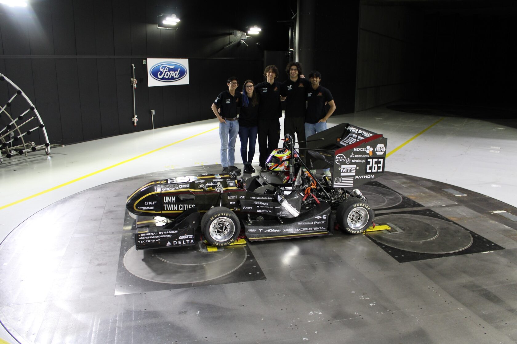 Gopher Motorsports team with their Formula SAE Electric race car