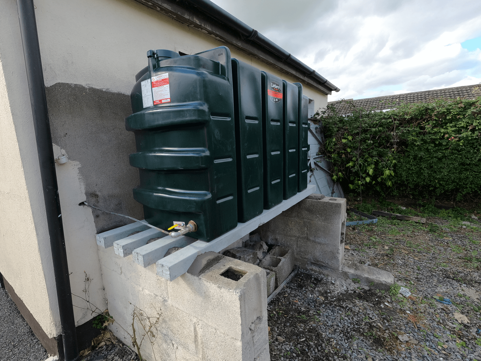 Scenic view of an Irish home with visible heating oil tank