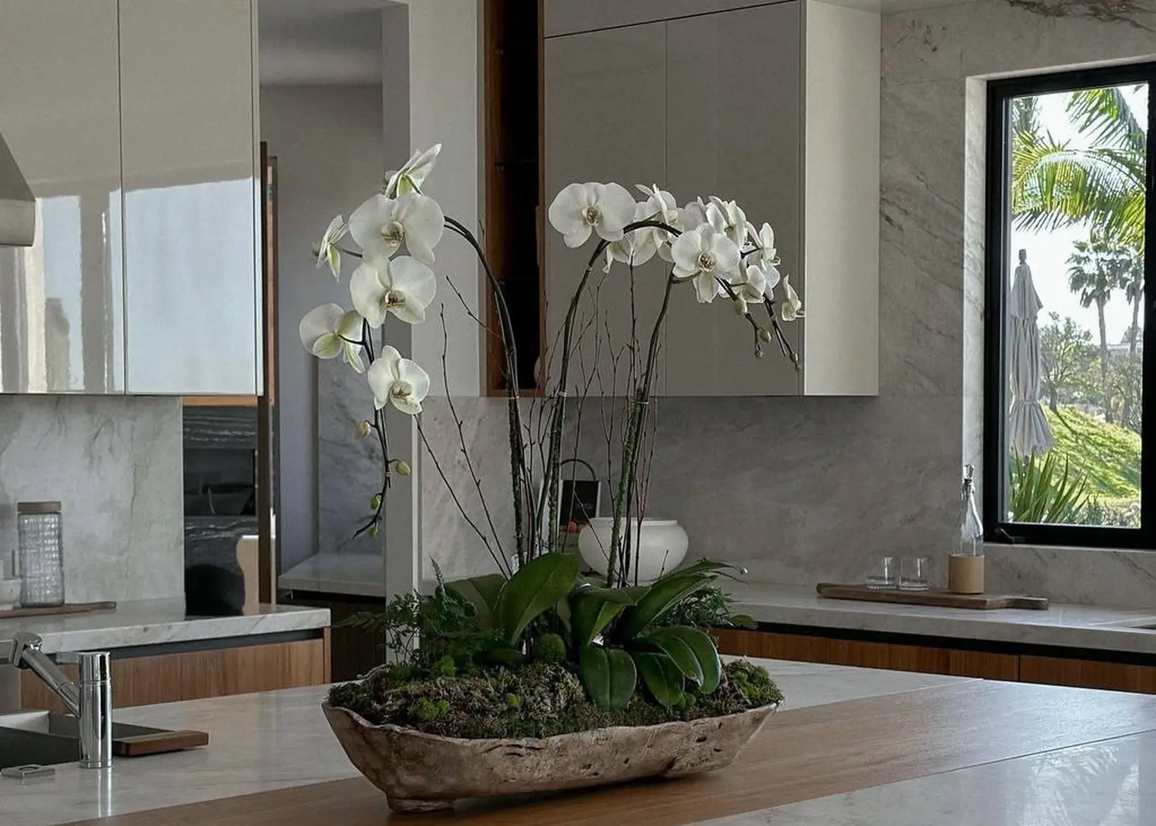 Orchid arrangement in a staged luxury home living room