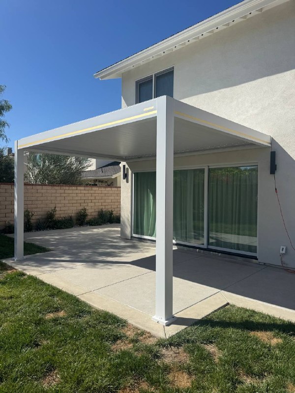 White wall-mounted motorized patio cover in Huntington Beach California