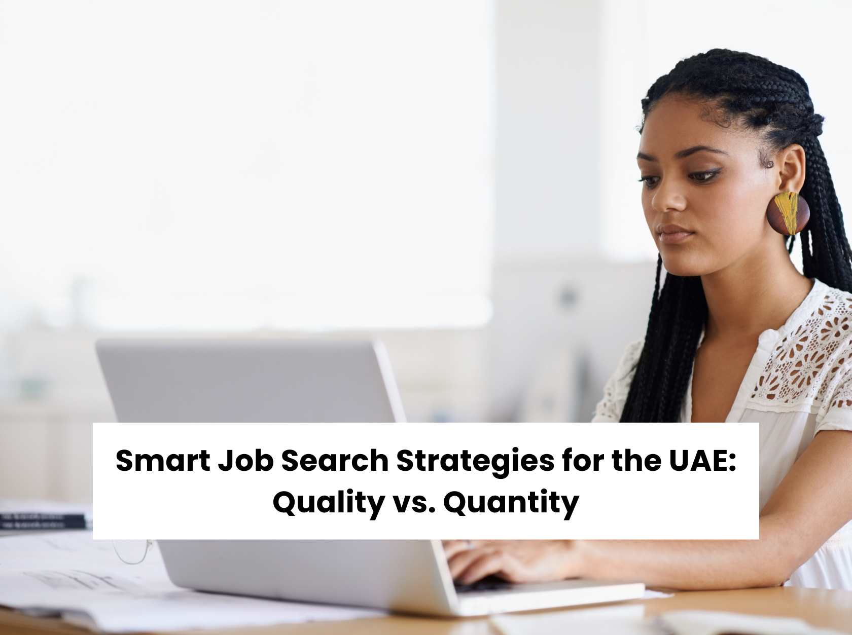 Focused job seeker researching smart job search strategies on a laptop — quality vs. quantity in the UAE job market.
