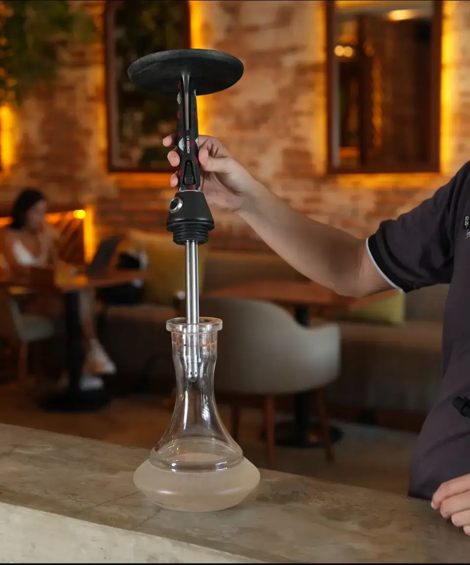  Inserting the hookah stem into the glass base
