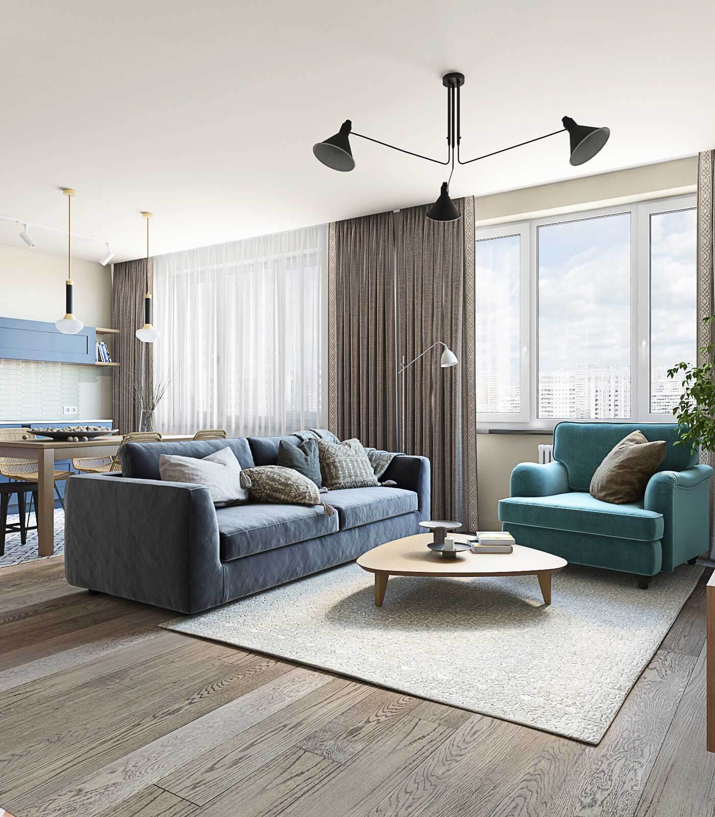 Гостиная с синим диваном и мягким бирюзовым креслом. Лофтовый светильник в гостиной