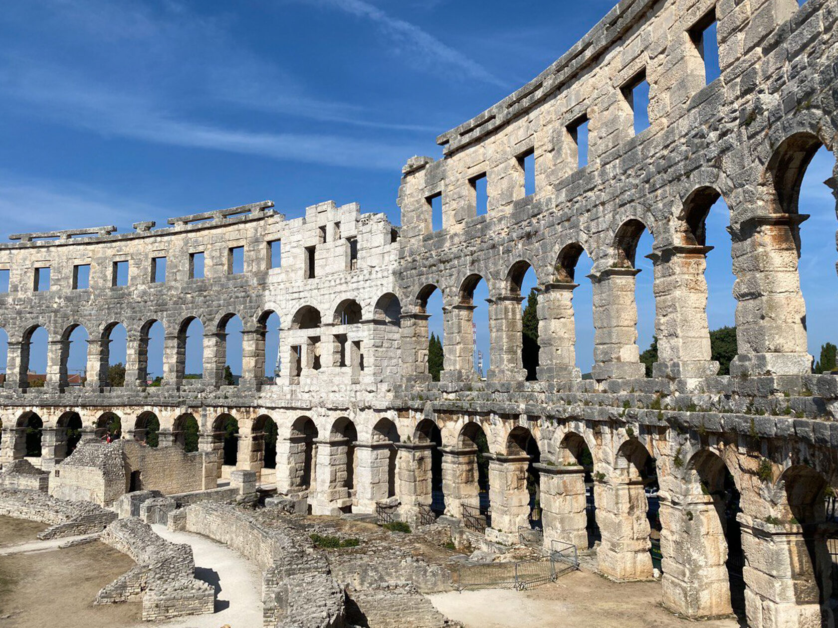 discover Pula Arena with tesla model 3 rental