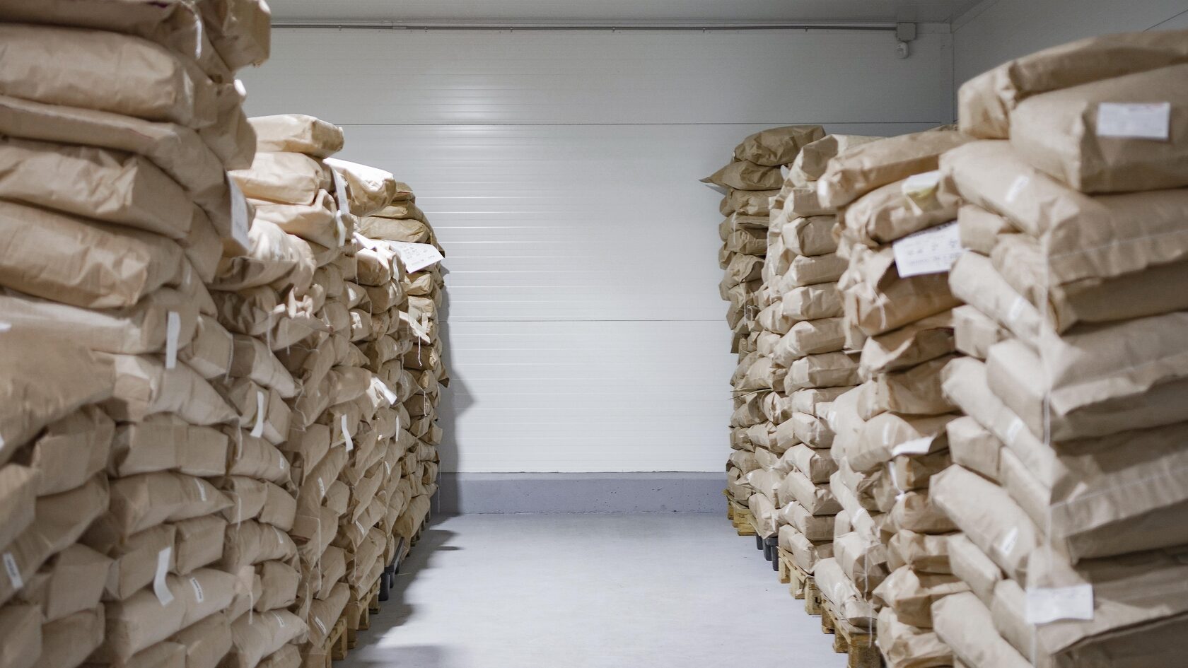 Bulk bags of hydrolyzed marine collagen powder in a warehouse