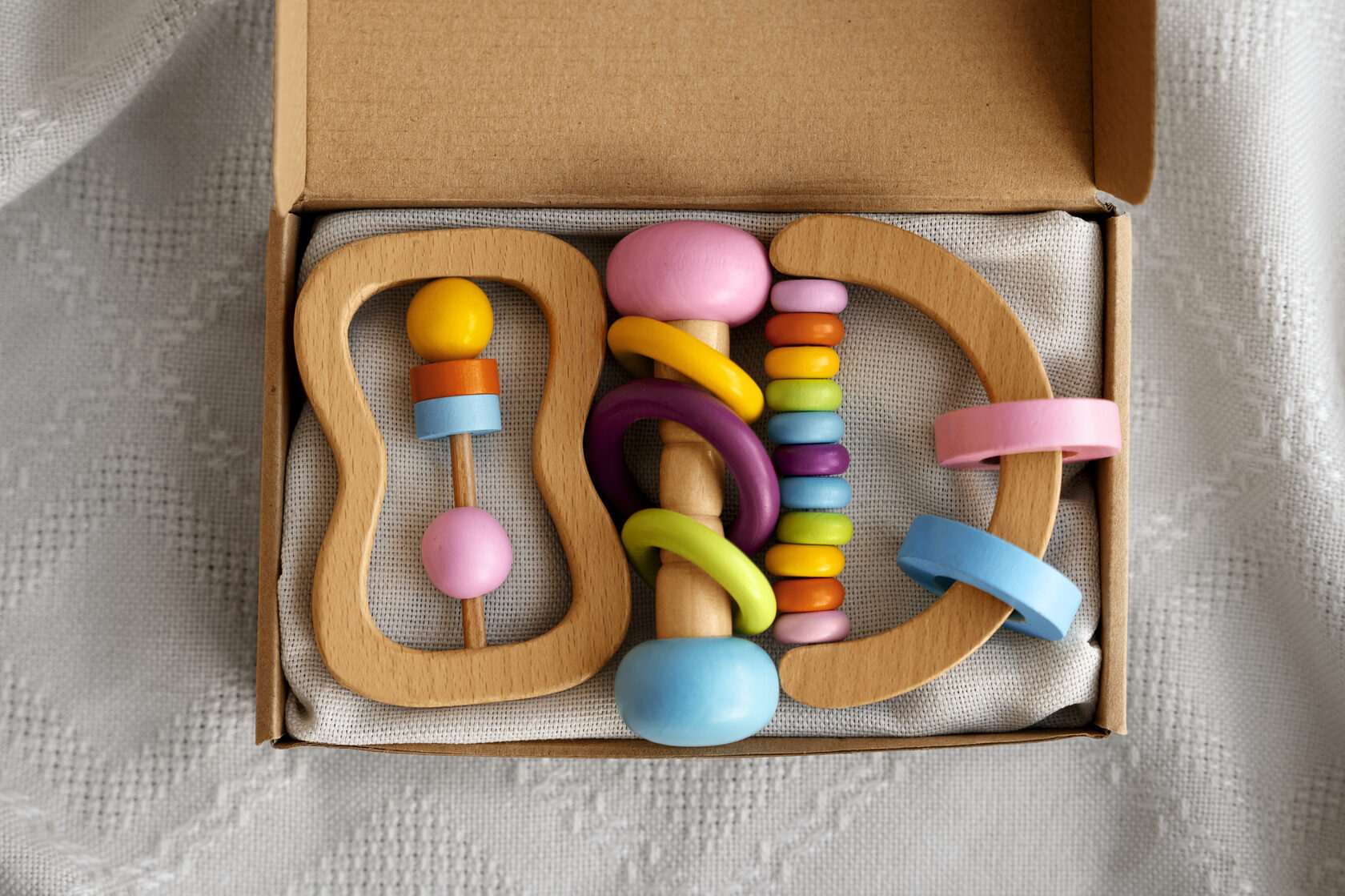 Colorful wooden baby toys, supporting sensory play and early development in well-slept baby
