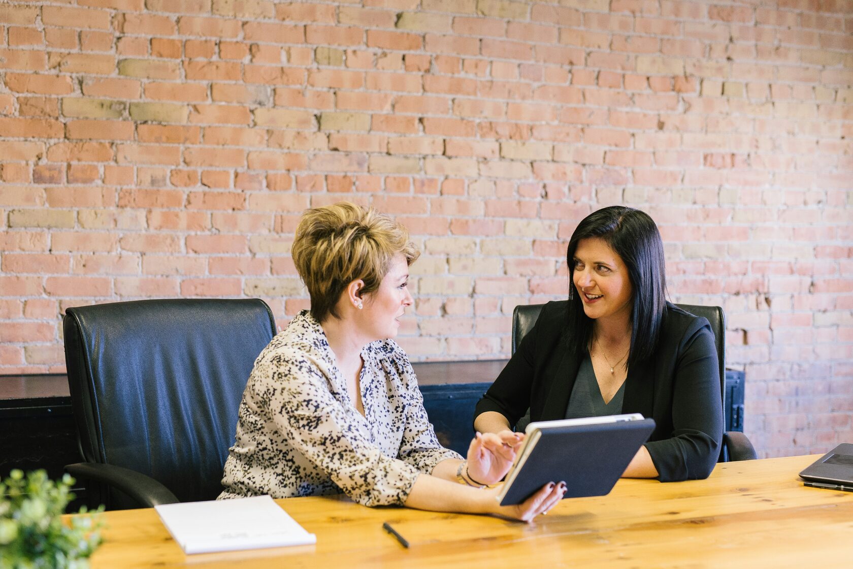 Immigration attorney consulting a couple about green card process