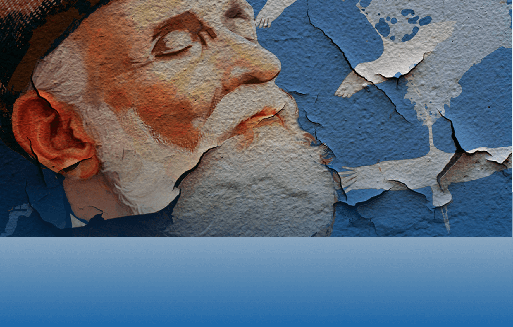 Изображение старца в граффити на заштукатуренной стене